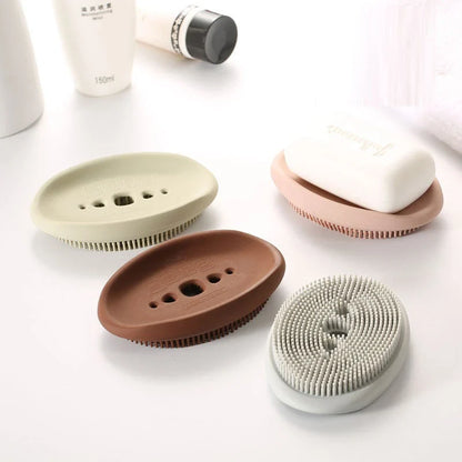 Versatile silicone soap holder with attached cleaning brush, available in a range of Kiwi-inspired Nordic colours and shapes