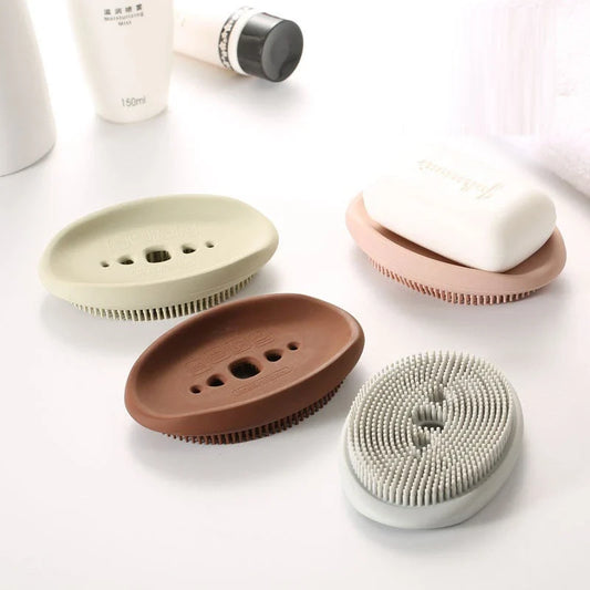 Versatile silicone soap holder with attached cleaning brush, available in a range of Kiwi-inspired Nordic colours and shapes