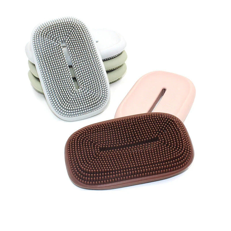 Versatile silicone soap holder with attached cleaning brush, available in a range of Kiwi-inspired Nordic colours and shapes