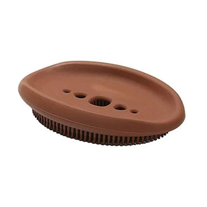 Versatile silicone soap holder with attached cleaning brush, available in a range of Kiwi-inspired Nordic colours and shapes