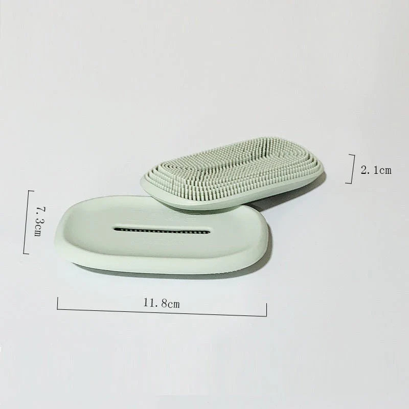 Versatile silicone soap holder with attached cleaning brush, available in a range of Kiwi-inspired Nordic colours and shapes