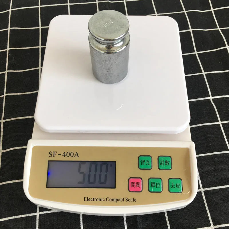 SF-400A electronic digital kitchen scale with 10kg maximum capacity on a kitchen worktop.