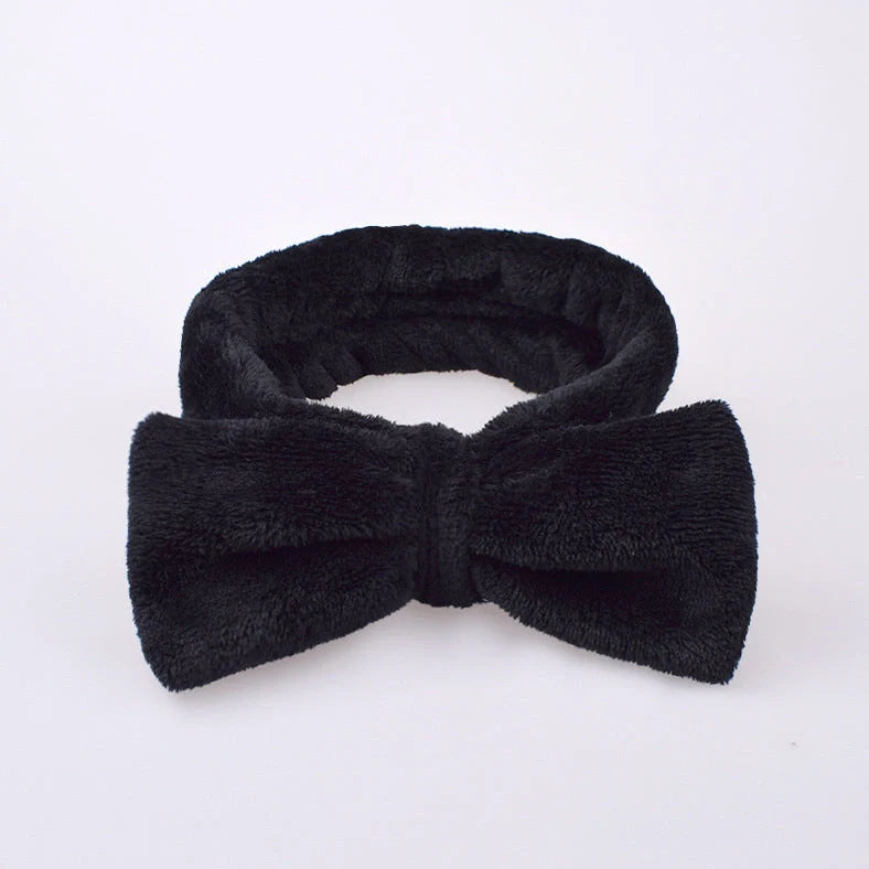 Coral velvet butterfly end hair band in pink with text styling, showing butterfly ends and cloth material