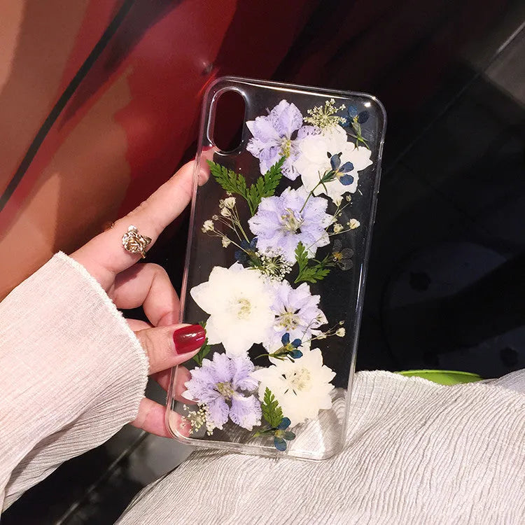 Soft TPU iPhone case with blue and purple dried flower basket design for multiple models.