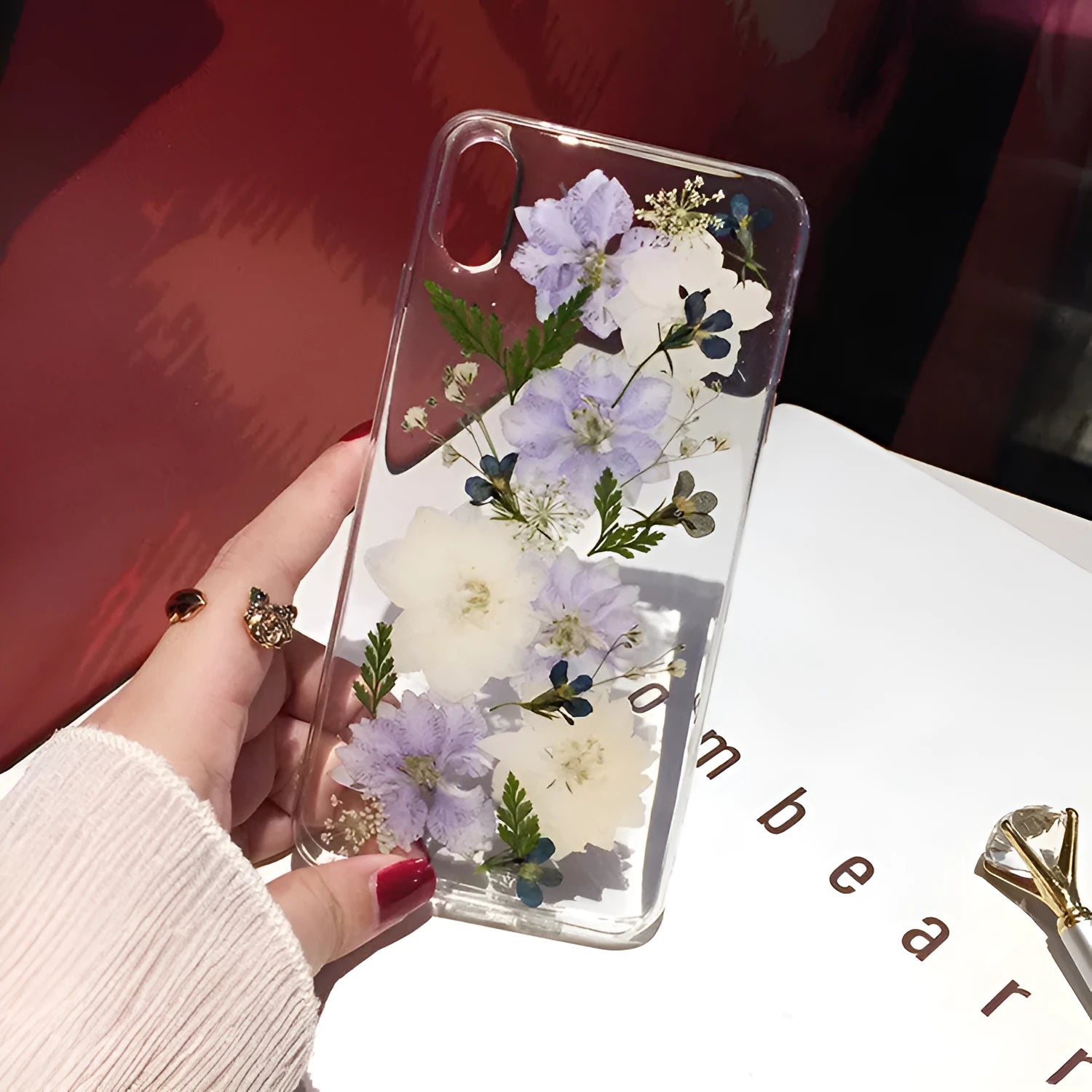 Soft TPU iPhone case with blue and purple dried flower basket design for multiple models.