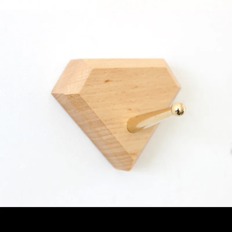Beech wood and brass adhesive wall hook with 10kg load capacity in modern design