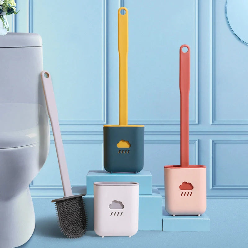 Wall-mounted silicone toilet brush tool in blue, grey, and pink with anti-adhesive coating