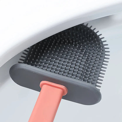 Wall-mounted silicone toilet brush tool in blue, grey, and pink with anti-adhesive coating