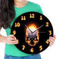 Burning skull wall clock with 30cm diameter, black PU shell, plastic dial, and 24-hour indication on a plain background