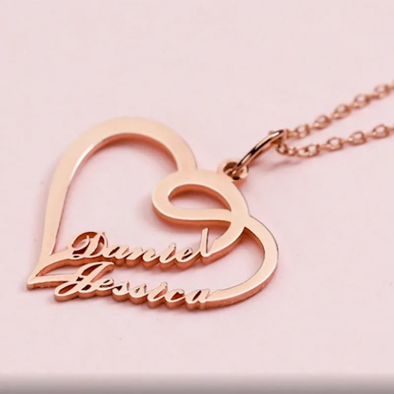 Double heart necklace with smooth textured pendant in gold finish on O-shaped chain