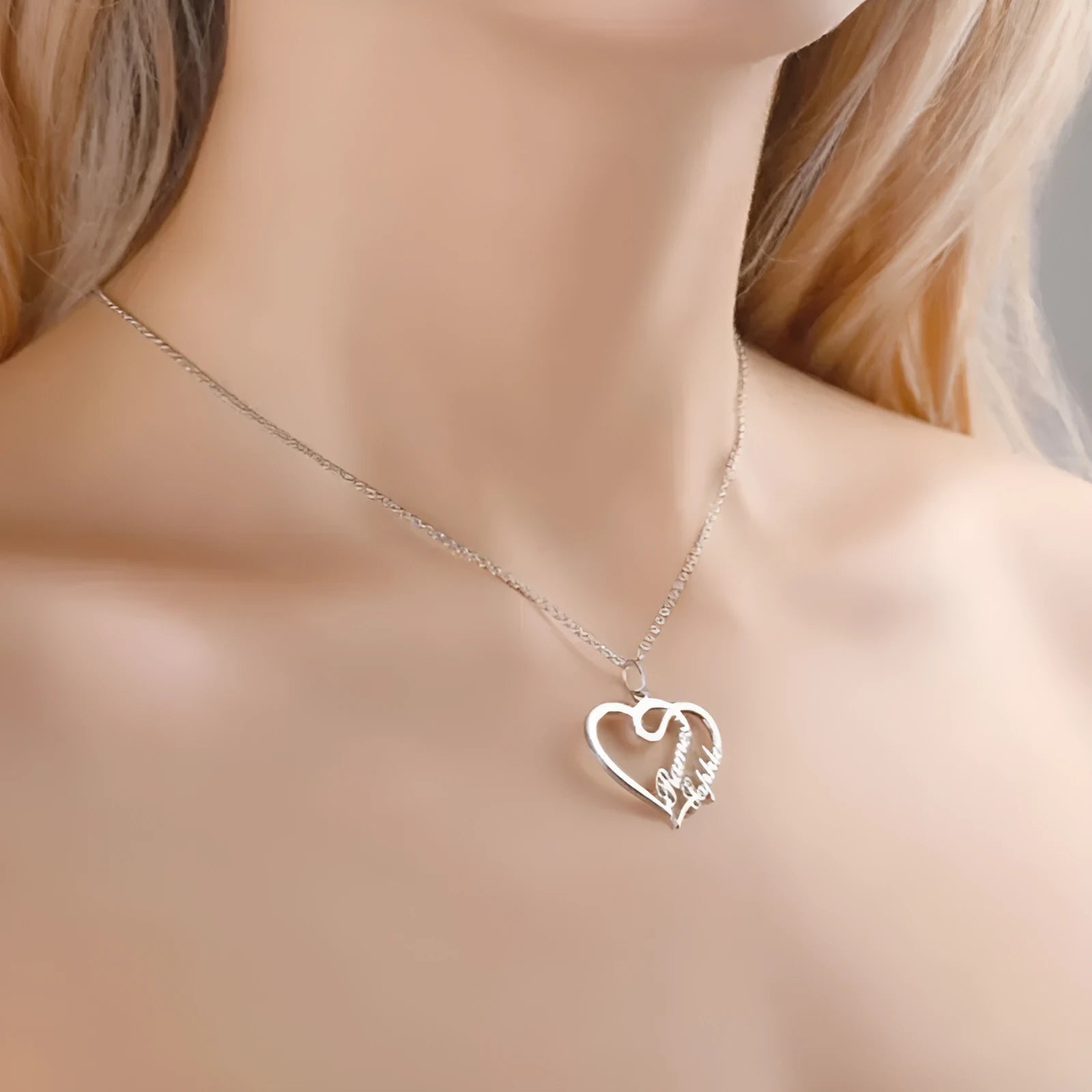 Double heart necklace with smooth textured pendant in gold finish on O-shaped chain