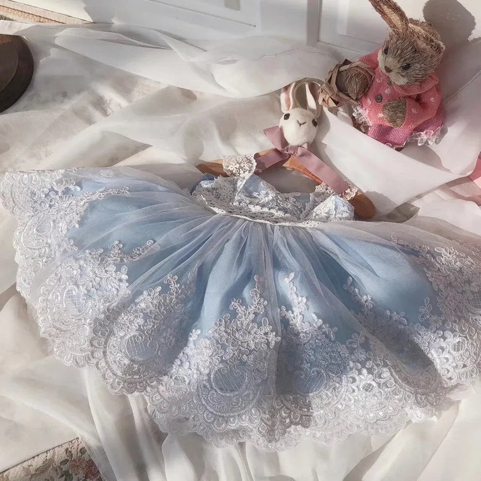 Ocean blue princess dress for baby girls with lace detailing, shown on hanger