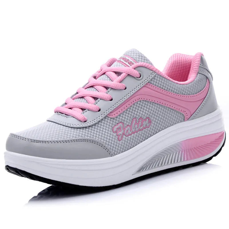 Women's single travel sports shoe in a choice of colours with a mid heel.