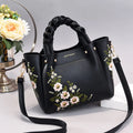 Medium PU leather drawstring tote bag for women in khaki, with shoulder strap and car stitching detail
