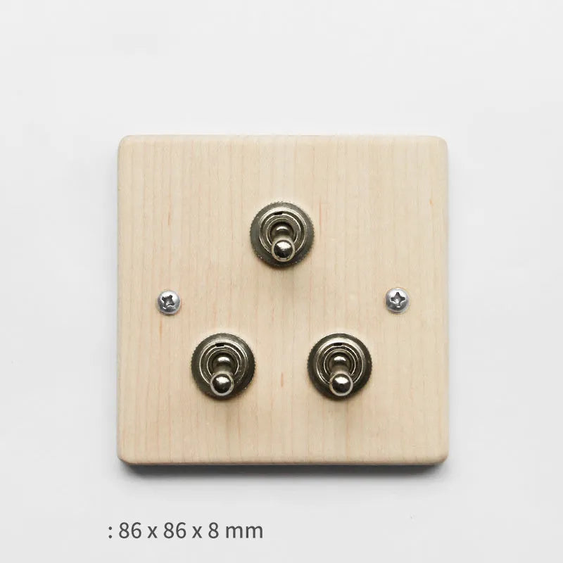 Brass lever light switch with black walnut square panel and black finish, single switch configuration