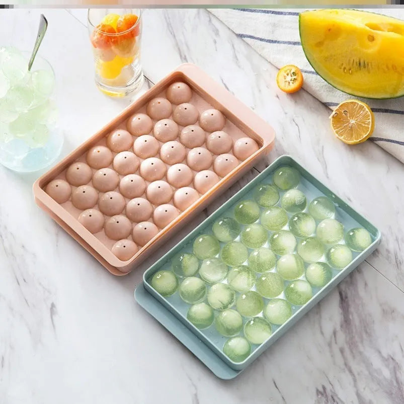 Sky blue and pink round ball ice cube trays showing 18 and 33 grid options