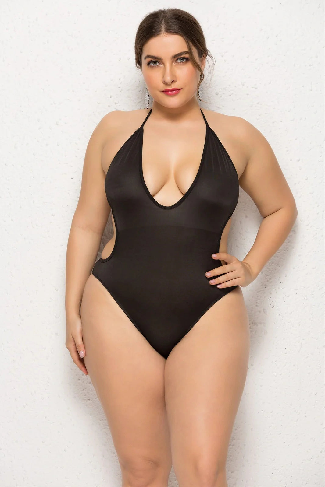 Black women's plus size swimsuit with deep V-neck and attached skirt, sling back design