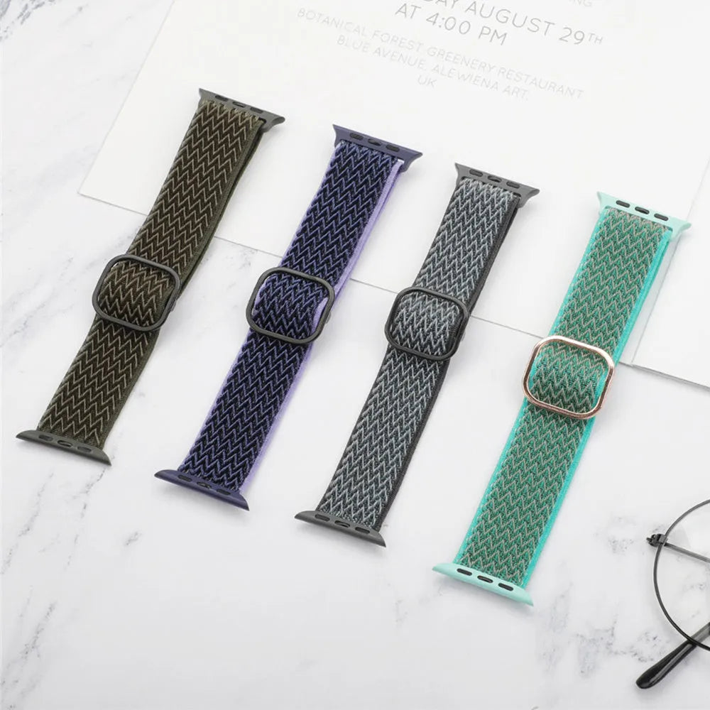 Braided nylon Apple Watch strap with wave pattern in multiple colour options on a wrist.