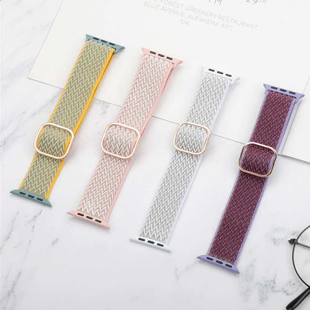 Braided nylon Apple Watch strap with wave pattern in multiple colour options on a wrist.