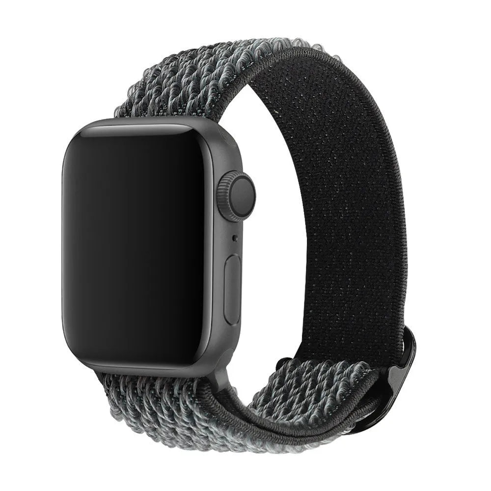 Braided nylon Apple Watch strap with wave pattern in multiple colour options on a wrist.