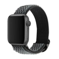 Braided nylon Apple Watch strap with wave pattern in multiple colour options on a wrist.
