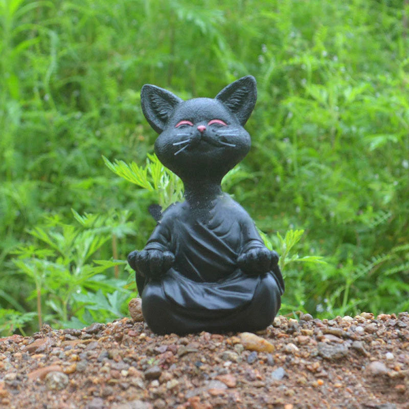 Charming ceramic Buddha cat figurine in black, grey, and orange colors for meditation, yoga, and home decor