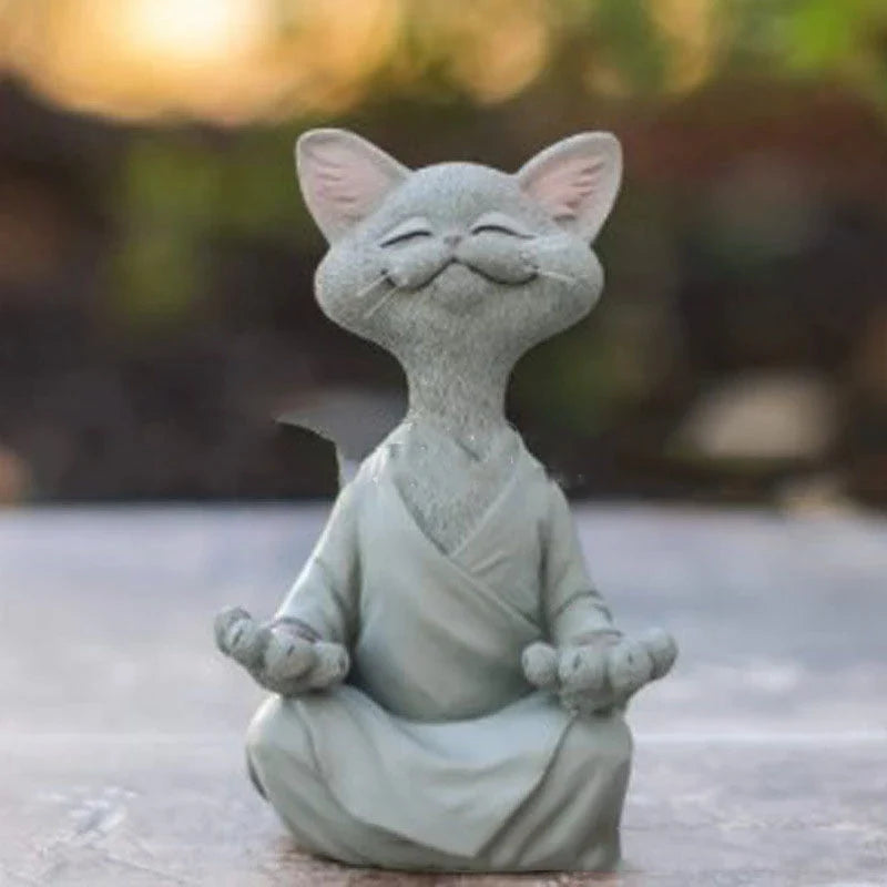 Charming ceramic Buddha cat figurine in black, grey, and orange colors for meditation, yoga, and home decor