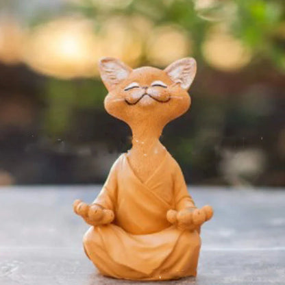 Charming ceramic Buddha cat figurine in black, grey, and orange colors for meditation, yoga, and home decor