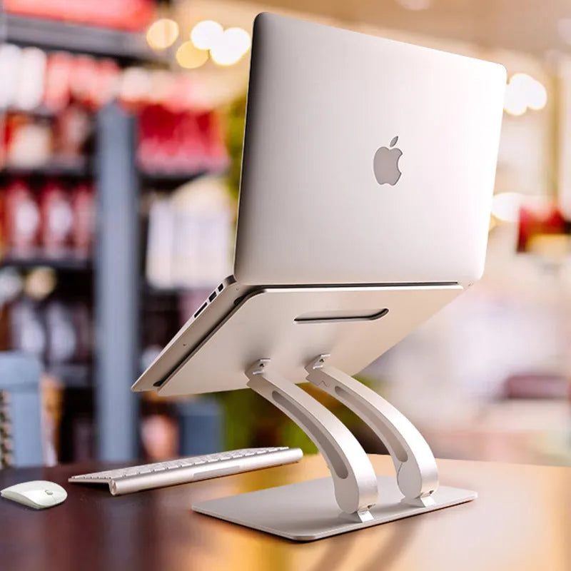 Folding laptop stand in aluminium alloy, gray colour, raised position showing open-frame cooling base