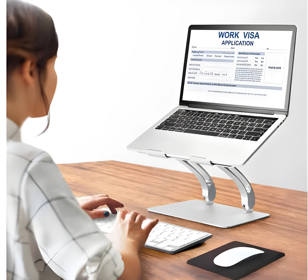 Folding laptop stand in aluminium alloy, gray colour, raised position showing open-frame cooling base