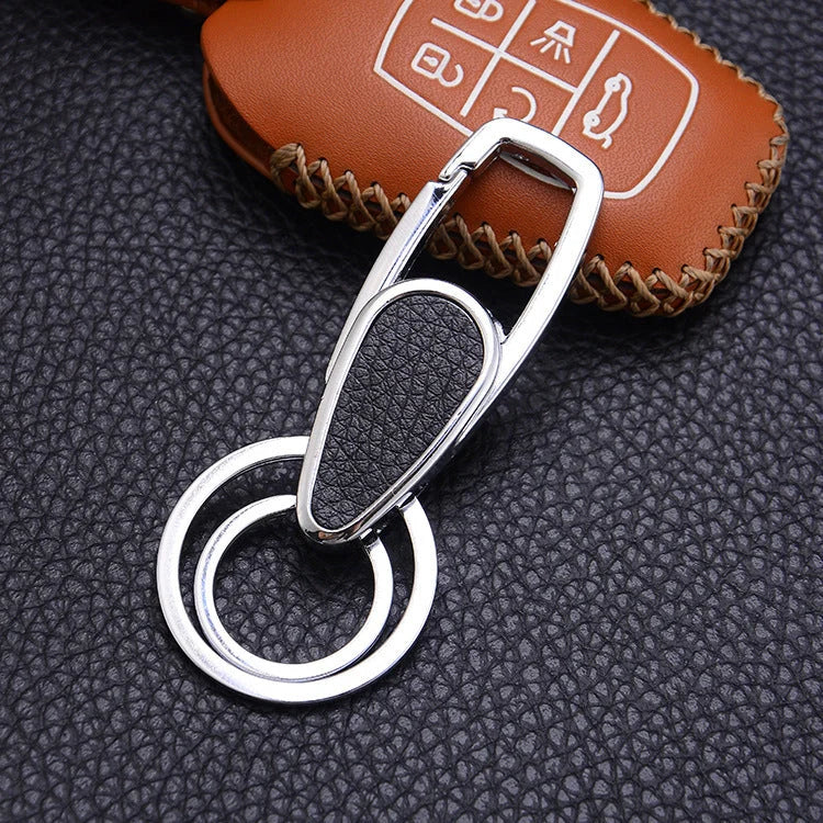 Heart-shaped leather and metal keychain in various colours