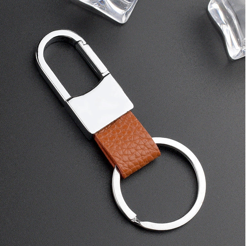 Heart-shaped leather and metal keychain in various colours