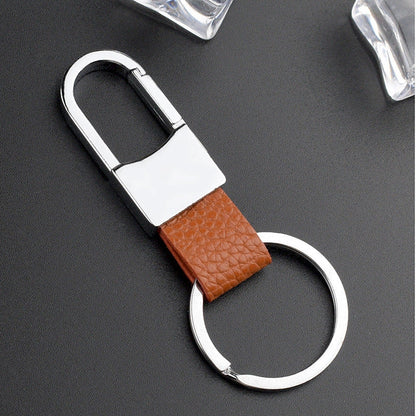 Heart-shaped leather and metal keychain in various colours