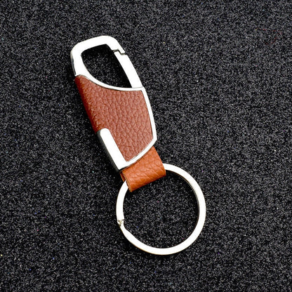 Heart-shaped leather and metal keychain in various colours