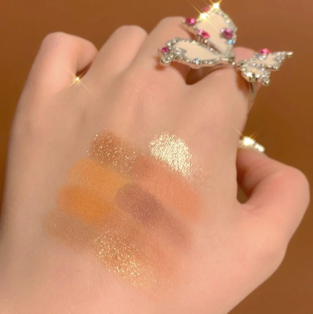 DANMOLU Shaved Mouse Eyeshadow Palette showing 12 colour pans in compact 15cm x 10cm case with dual-ended applicator