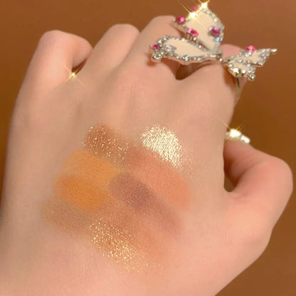 DANMOLU Shaved Mouse Eyeshadow Palette showing 12 colour pans in compact 15cm x 10cm case with dual-ended applicator