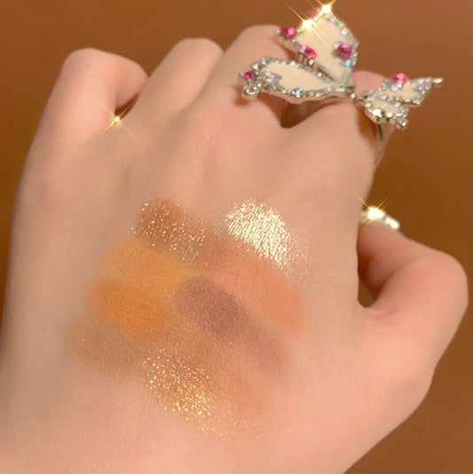 DANMOLU Shaved Mouse Eyeshadow Palette showing 12 colour pans in compact 15cm x 10cm case with dual-ended applicator