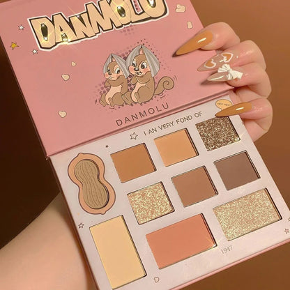 DANMOLU Shaved Mouse Eyeshadow Palette showing 12 colour pans in compact 15cm x 10cm case with dual-ended applicator