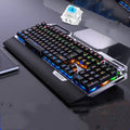 Silver Carving K100 metal mechanical keyboard with black axis keys, seven-color backlight, large hand rest, and phone holder on a desk