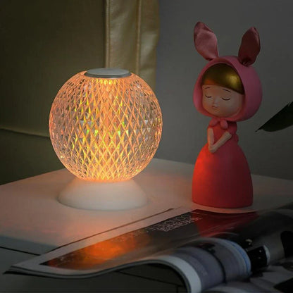 Acrylic crystal lamp with adjustable touch controls, emitting a warm, soothing glow for a relaxing ambiance