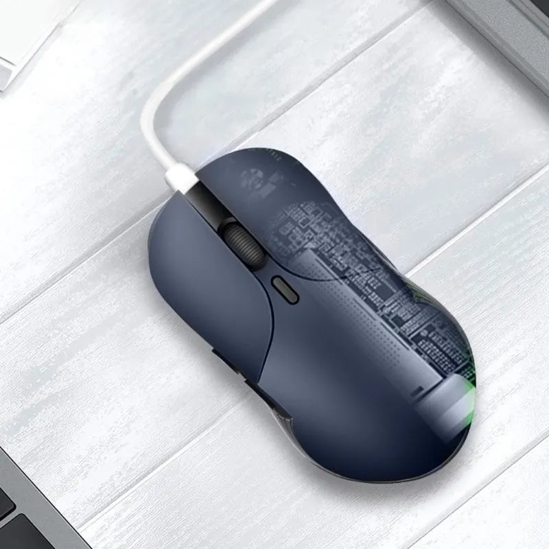 Blue Smart Voice Mouse with translation function on a desk next to a laptop.