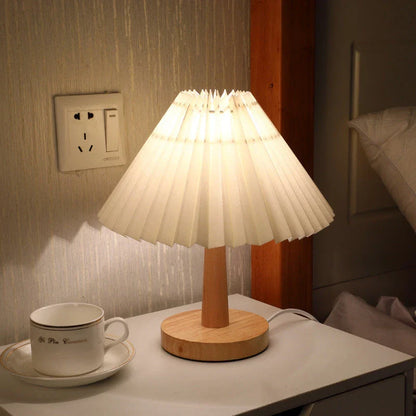 Versatile bedside lamp with dimmable LED light, bamboo base, and pleated fabric shade for New Zealand homes