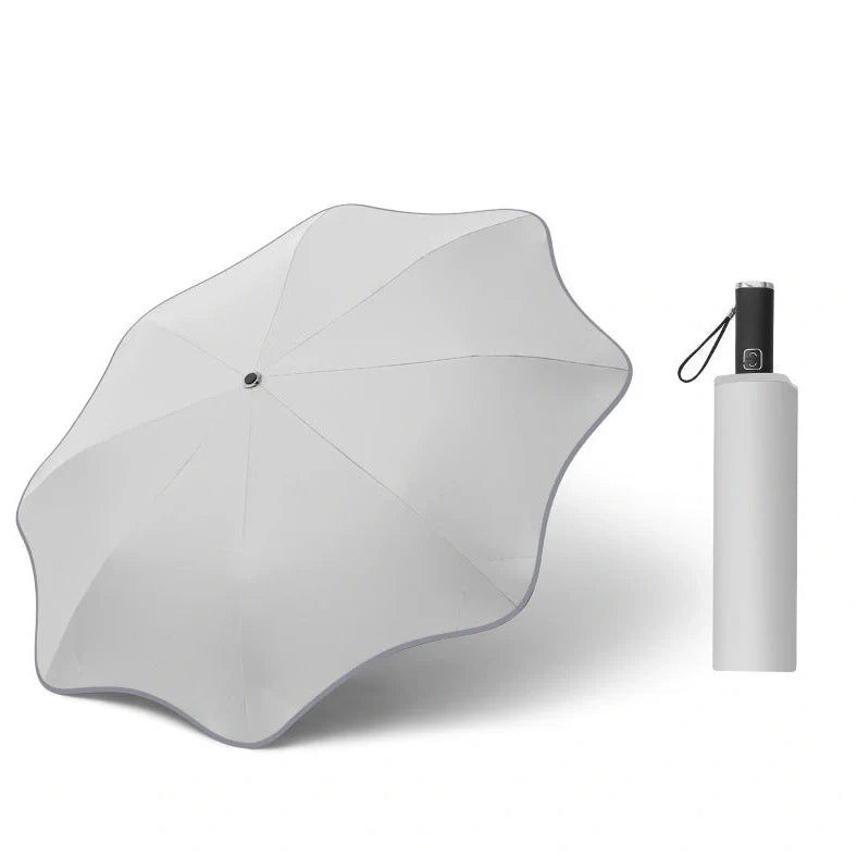 Curved automatic umbrella with luminous transparent canopy showing 8 alloy ribs and rubber handle