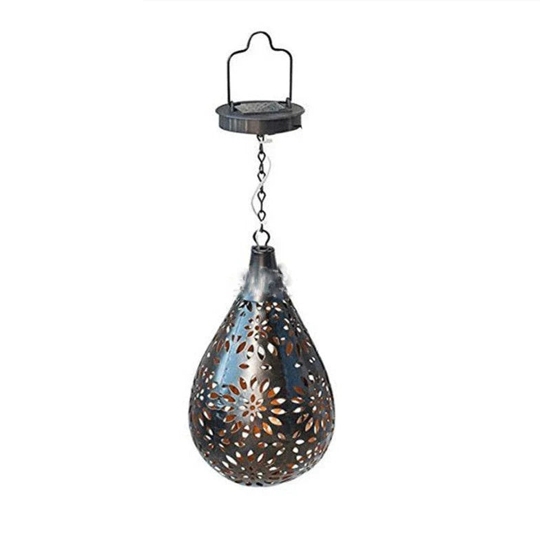 Solar-powered outdoor hanging lantern with flower-shaped light patterns and waterproof design for garden and patio decor