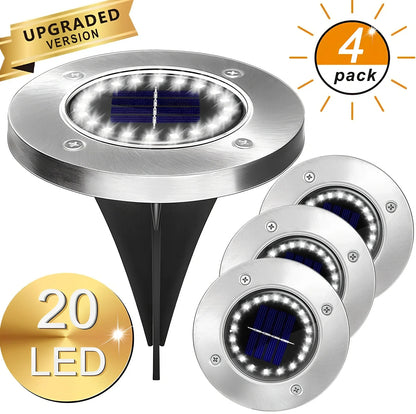 8LED waterproof solar garden light staked in lawn with warm glow, IP65 rated for rain resistance