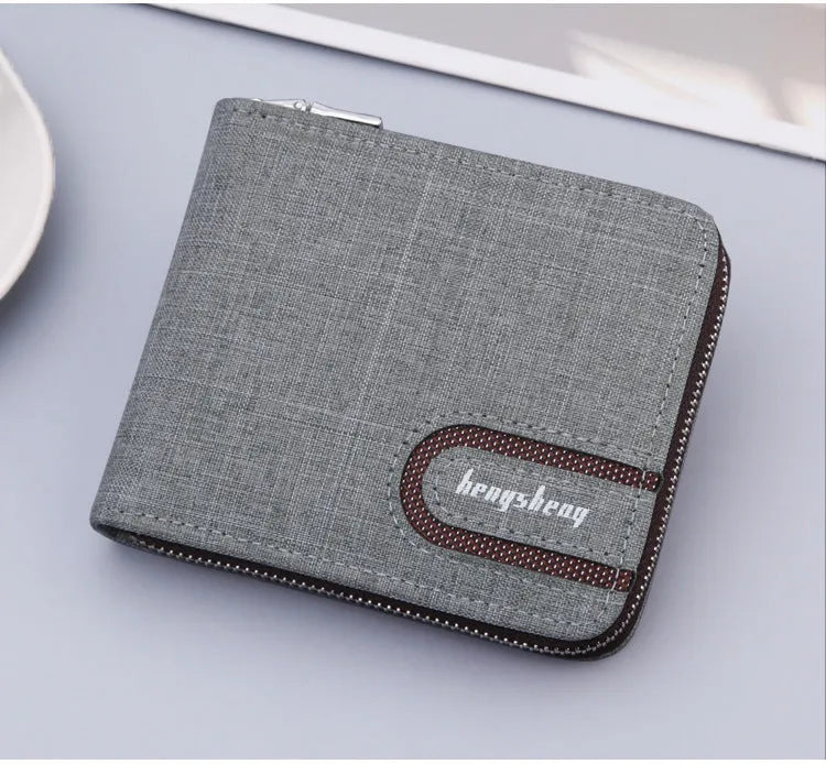 Canvas men's short zipper wallet with retro car suture pattern in black, brown, and light grey colours on a plain surface.