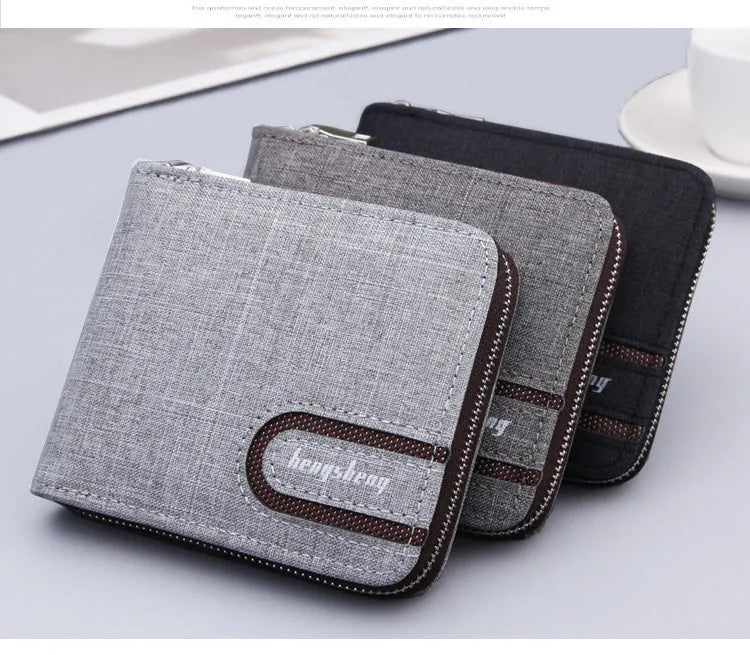Canvas men's short zipper wallet with retro car suture pattern in black, brown, and light grey colours on a plain surface.