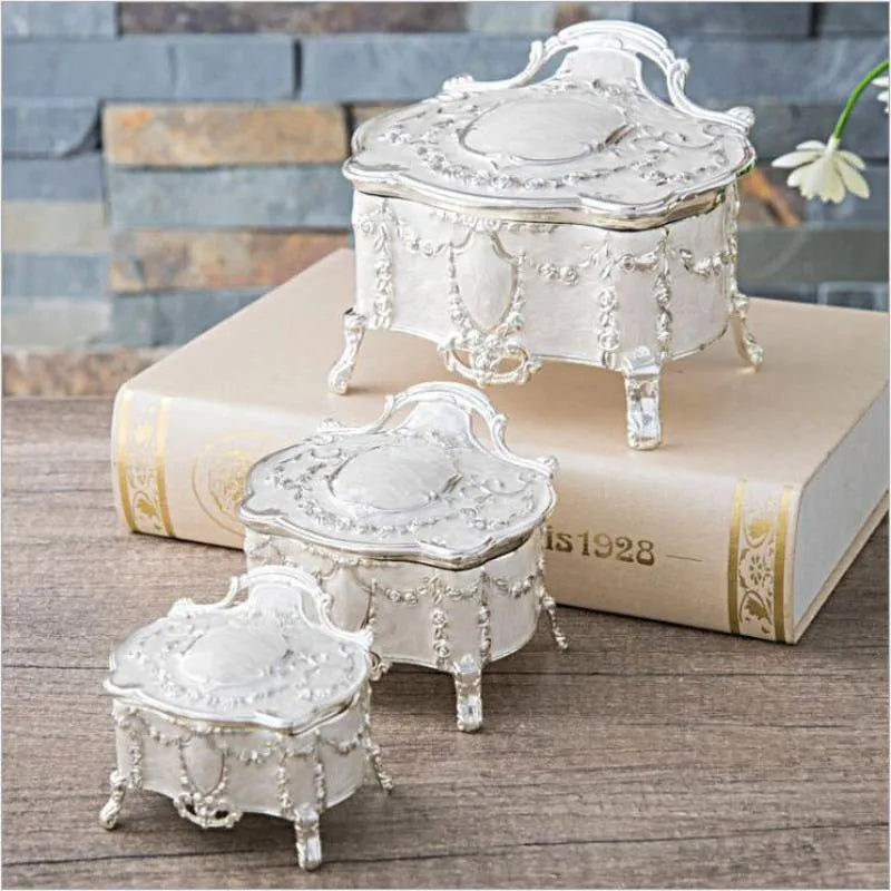 Ancient tin and silver white zinc alloy jewellery storage boxes in large, medium, and small sizes.
