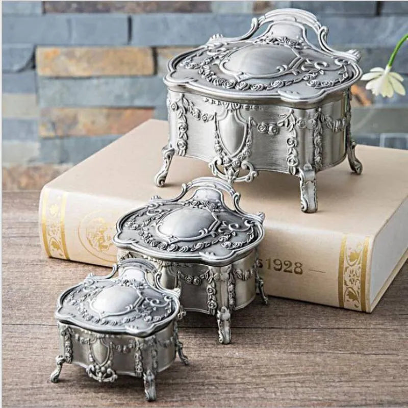 Ancient tin and silver white zinc alloy jewellery storage boxes in large, medium, and small sizes.