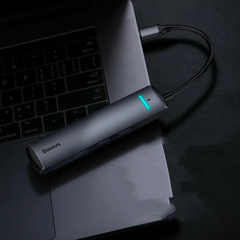 Non-Apple branded Type-C docking station in dark grey with mechanical eye design compatible with MacBook and iPhone